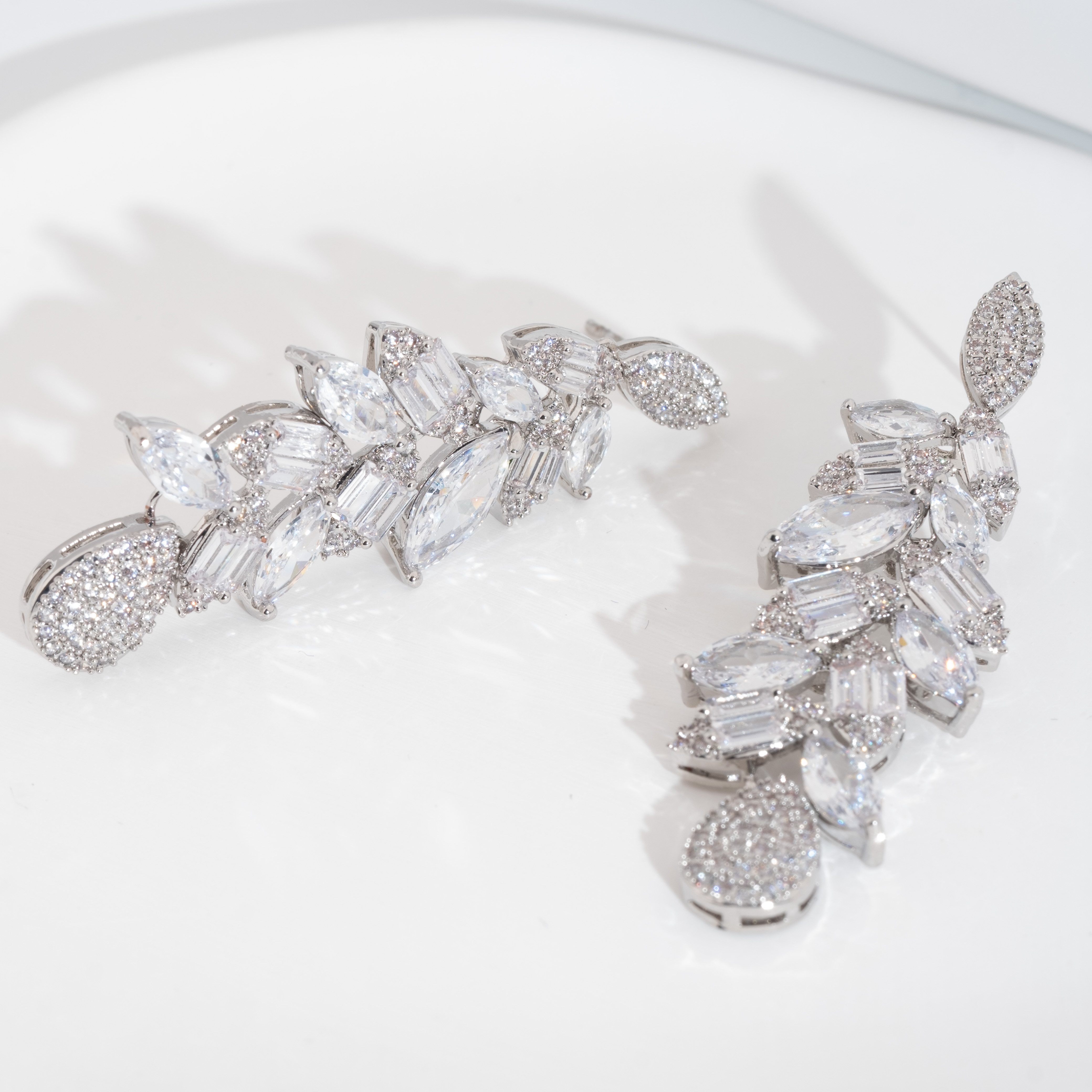 A set of luxurious and elegant earrings set with shiny cubic zirconia teardrop design is suitable for ladies to wear at weddings Specification image