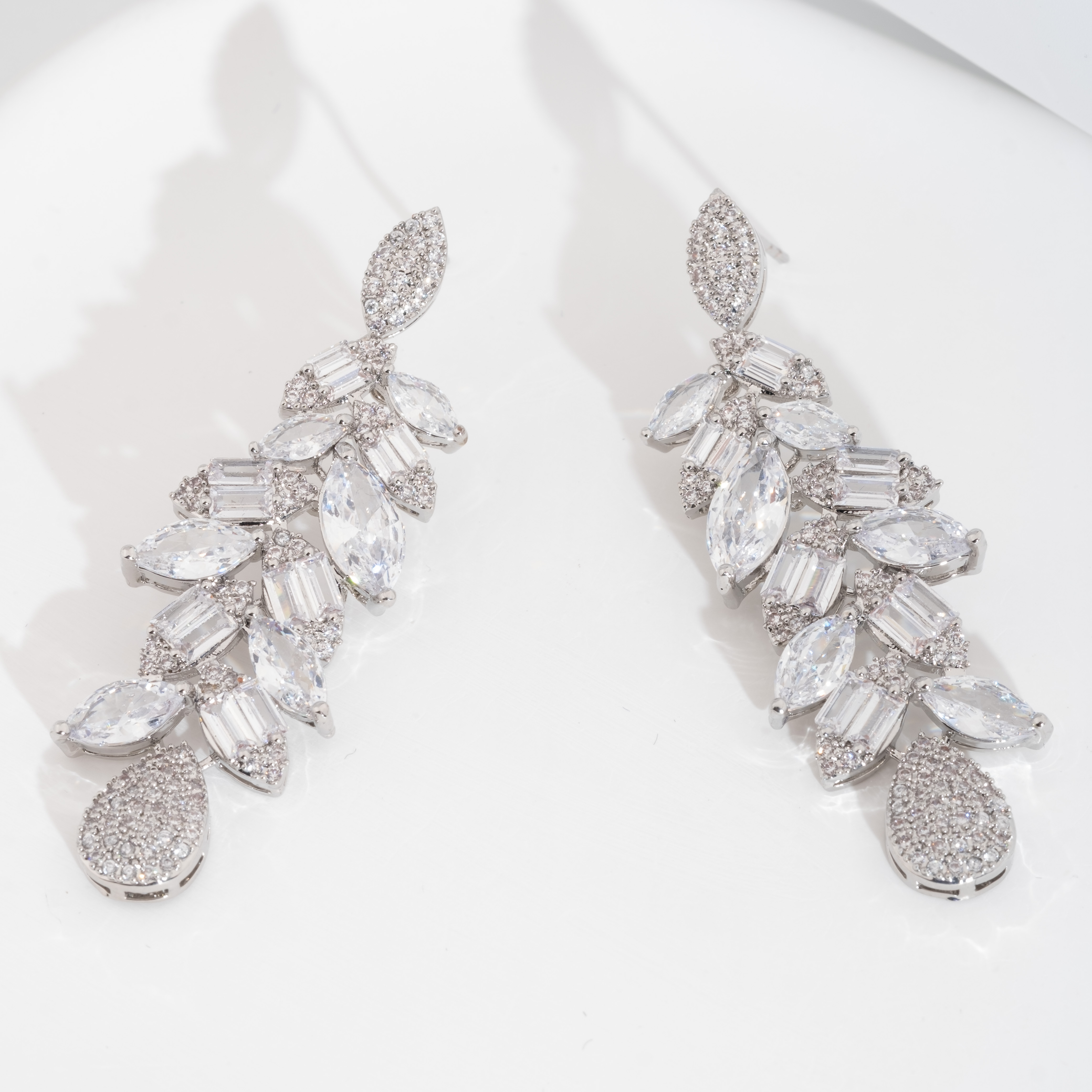 A set of luxurious and elegant earrings set with shiny cubic zirconia teardrop design is suitable for ladies to wear at weddings details Picture