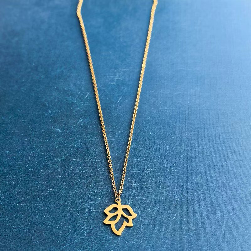 Stainless steel four-leaf clover maple leaf bracelet pendant, hollowed-out small tree titanium steel leaf necklace, diy handmade jewelry accessory Application Scenario