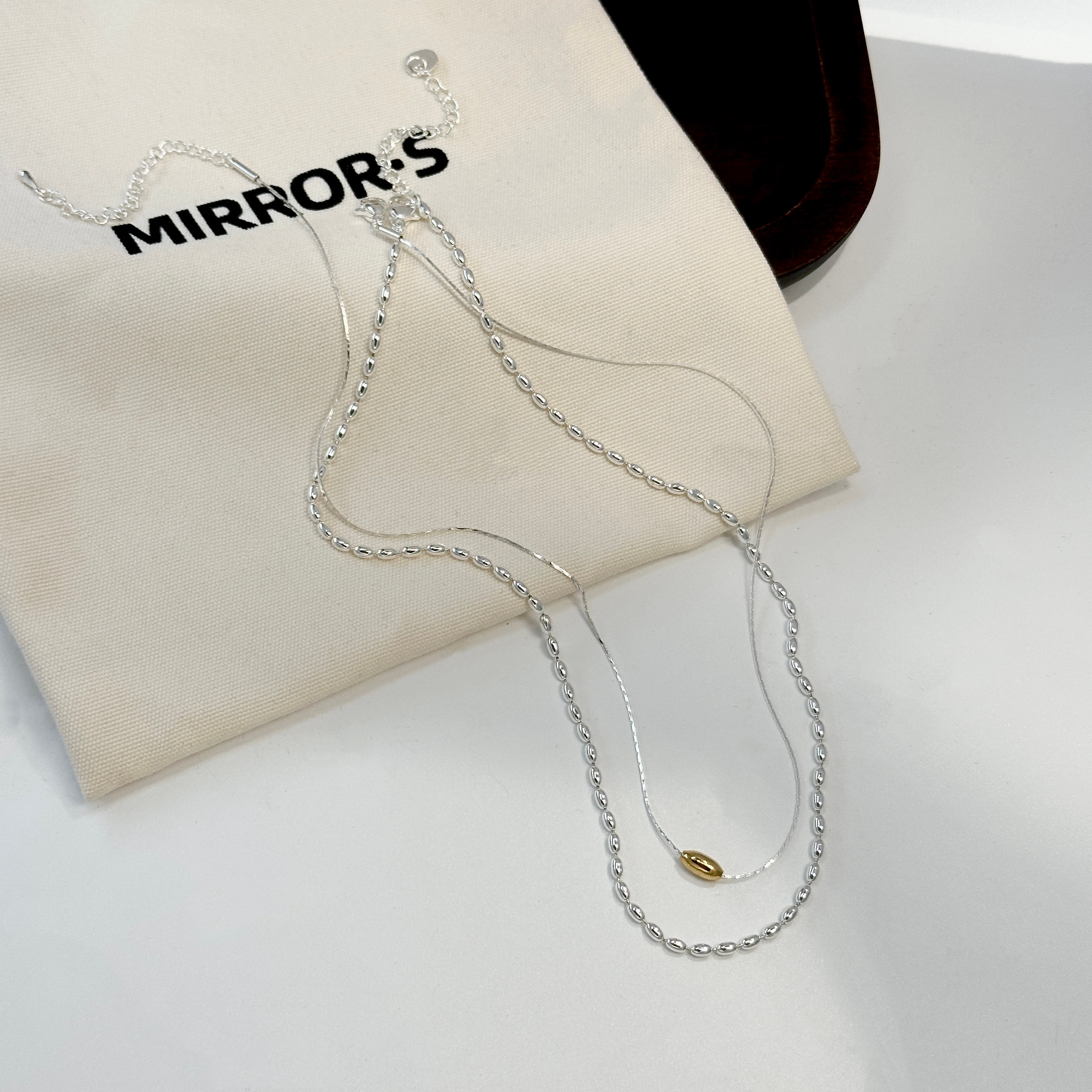 لؤلؤة الارزّ الذهبي، قلادة فضية جديدة Specification image