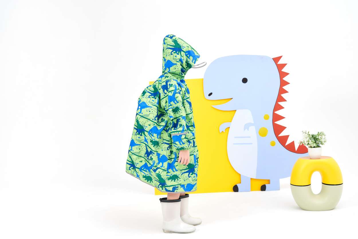儿童背包雨衣满印卡通图案学生男孩女孩上学通勤反光安全防暴雨多尺码可选环保无气味柔软布料时尚网红宝妈必选雨衣【史前巨兽】白底实物图