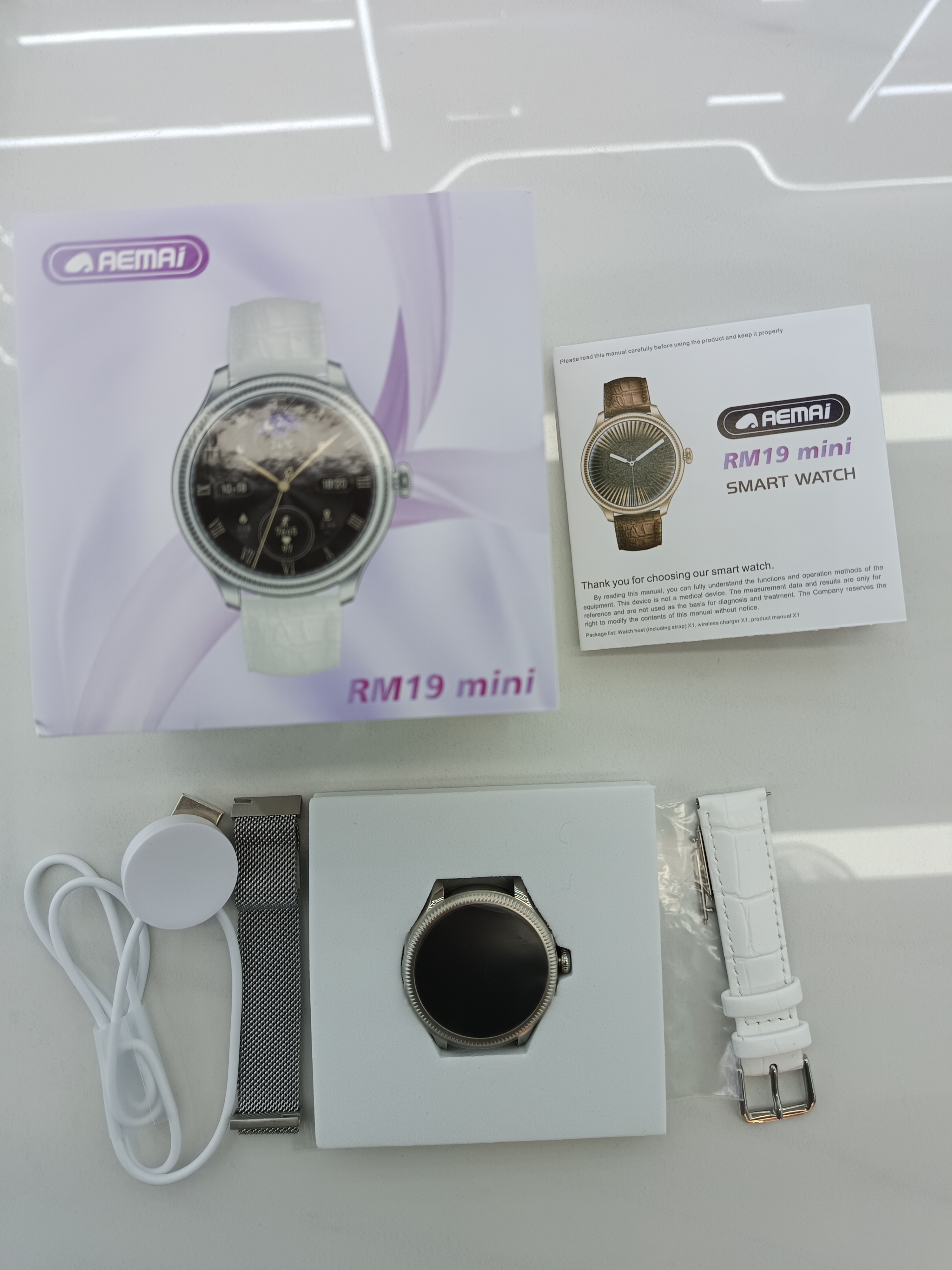 AEMAI RM19 mini Smart Sports Women's round Watch for making and receiving calls, heart rate and blood pressure detection, 2 silicone sports straps with accessories details Picture