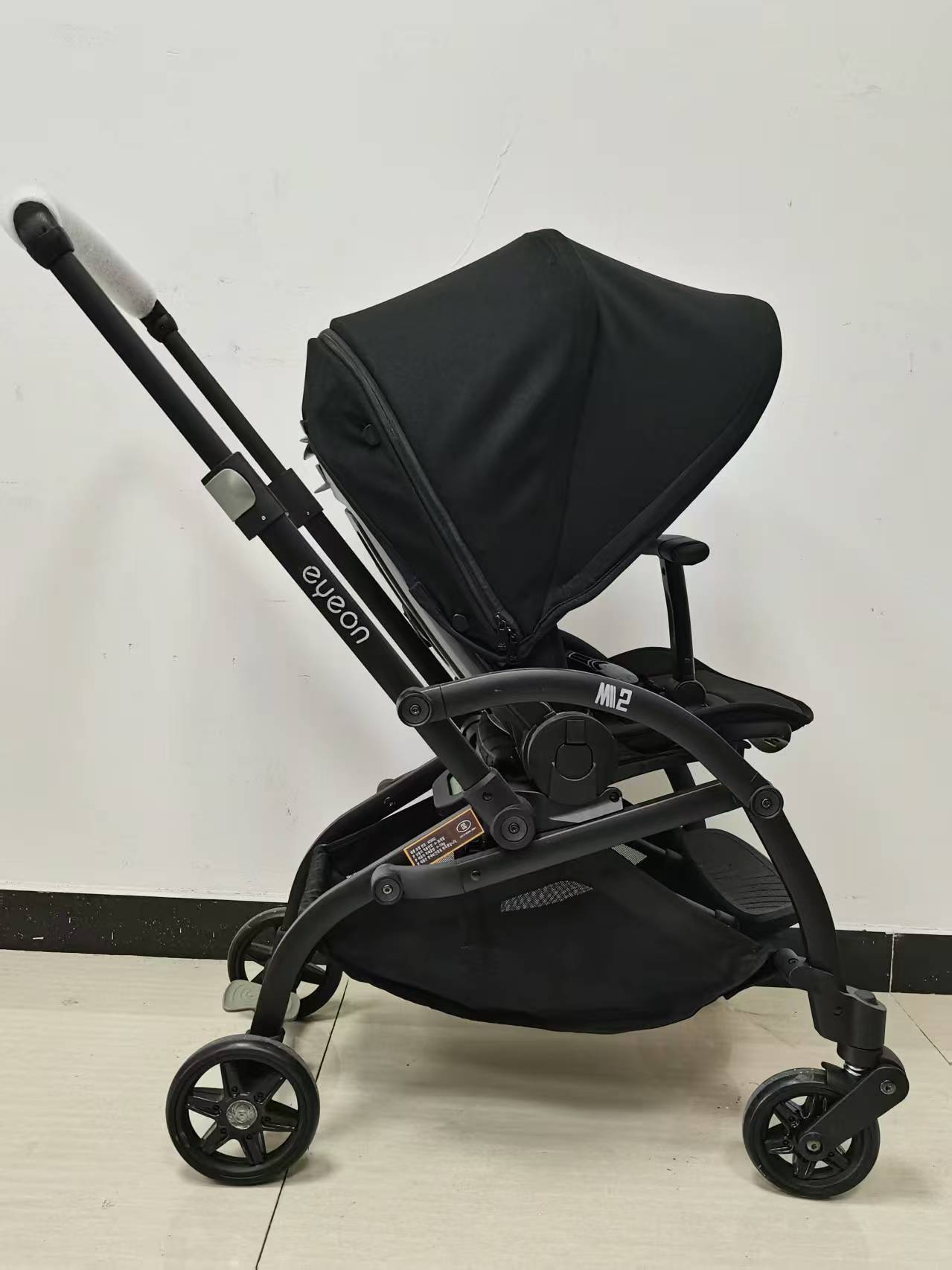 The baby stroller has a seat that can be redirected and is a pocket stroller details Picture