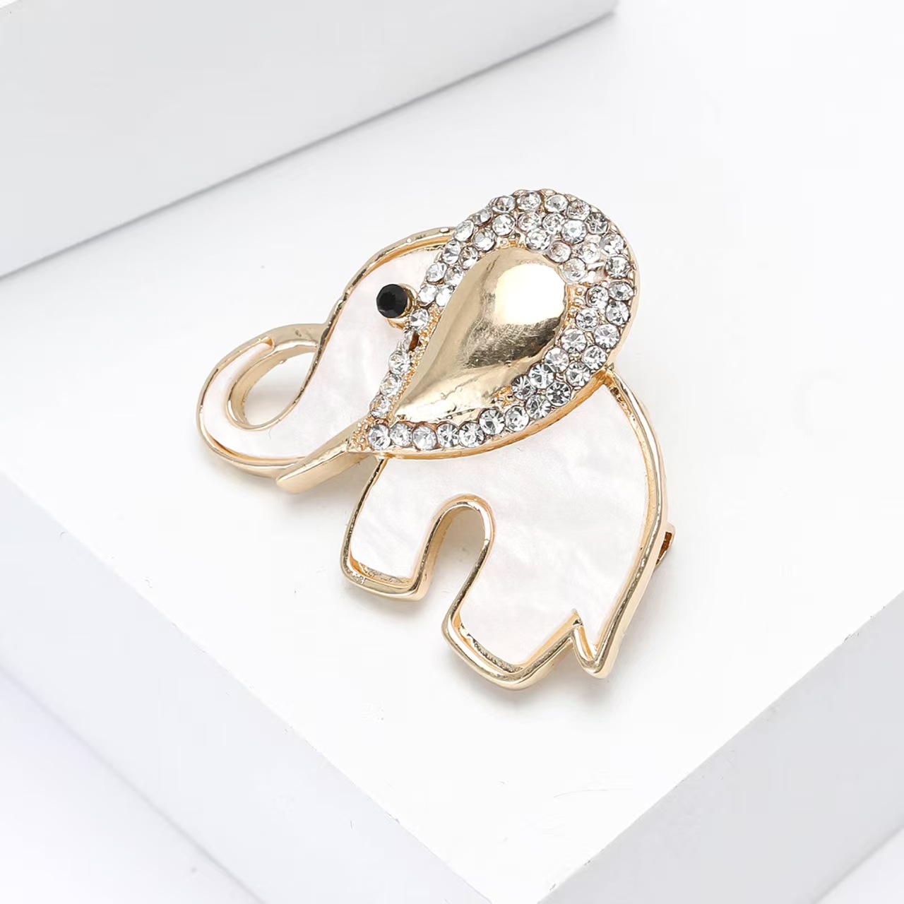 Elegant and luxurious alloy rhinestone white plate shell elephant brooch, elegant women's clothing brooch accessory pin details Picture