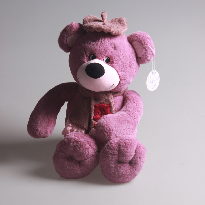 A plush bear with embroidered eyes in a hat and scarf style that can pass the inspection details Picture