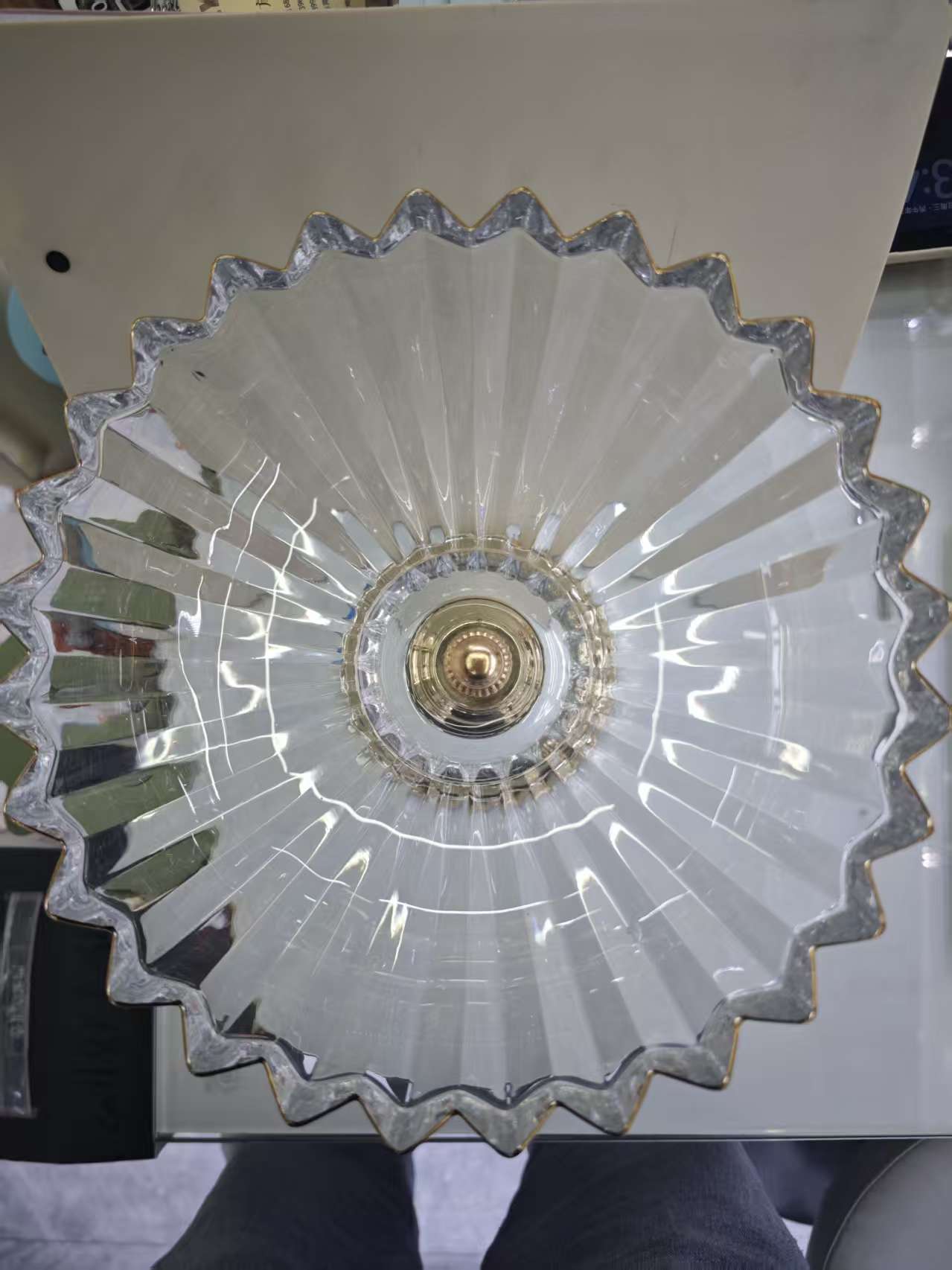 A crystal transparent glass fruit platter with a high gold base and golden edges details Picture