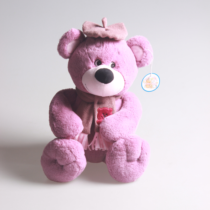 A plush bear with embroidered eyes in a hat and scarf style that can pass the inspection pic 1