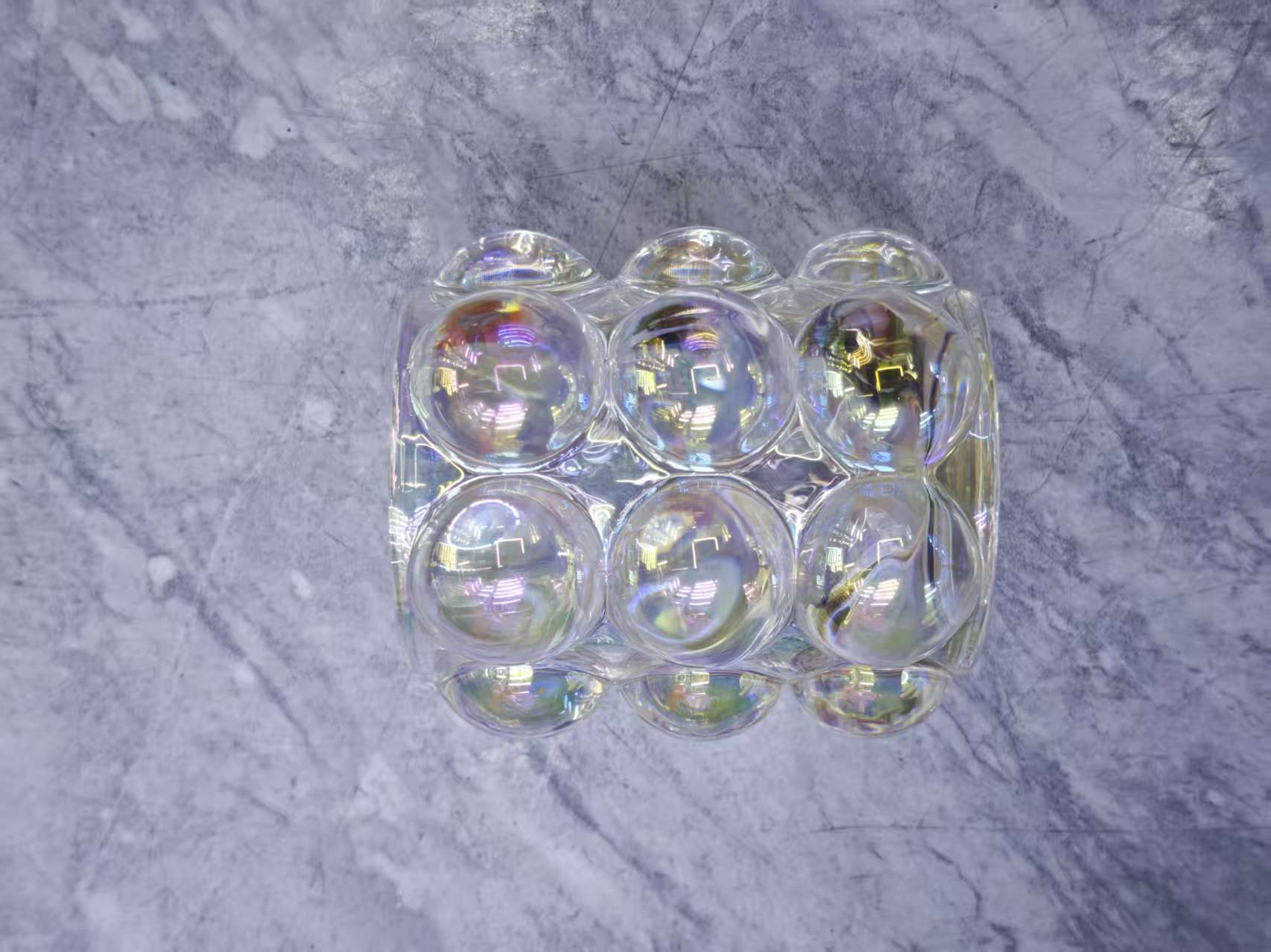 The transparent water cup is surrounded by colored glass balls Item Picture