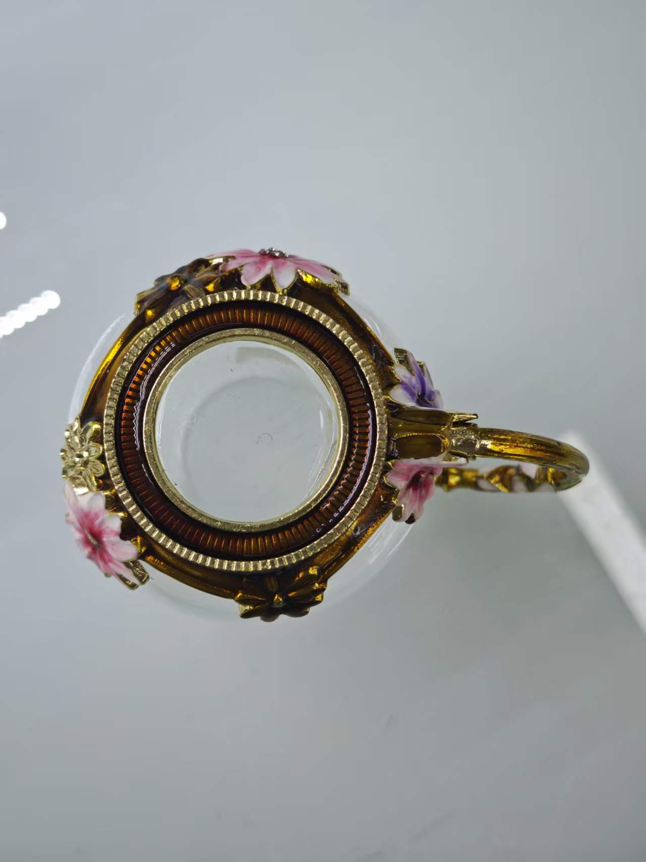 The elegant and anti-slip glass cup with a decorated gold flower handle is suitable for home and office use Application Scenario