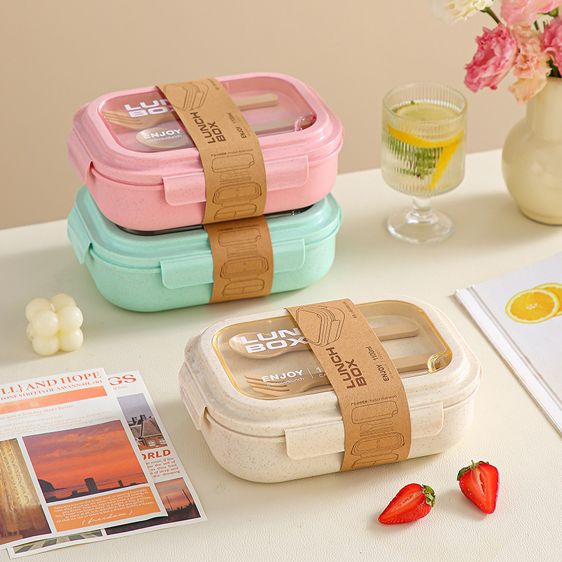 The plastic bamboo fiber eco-friendly storage lunch box with multiple compartments is portable and can be stacked