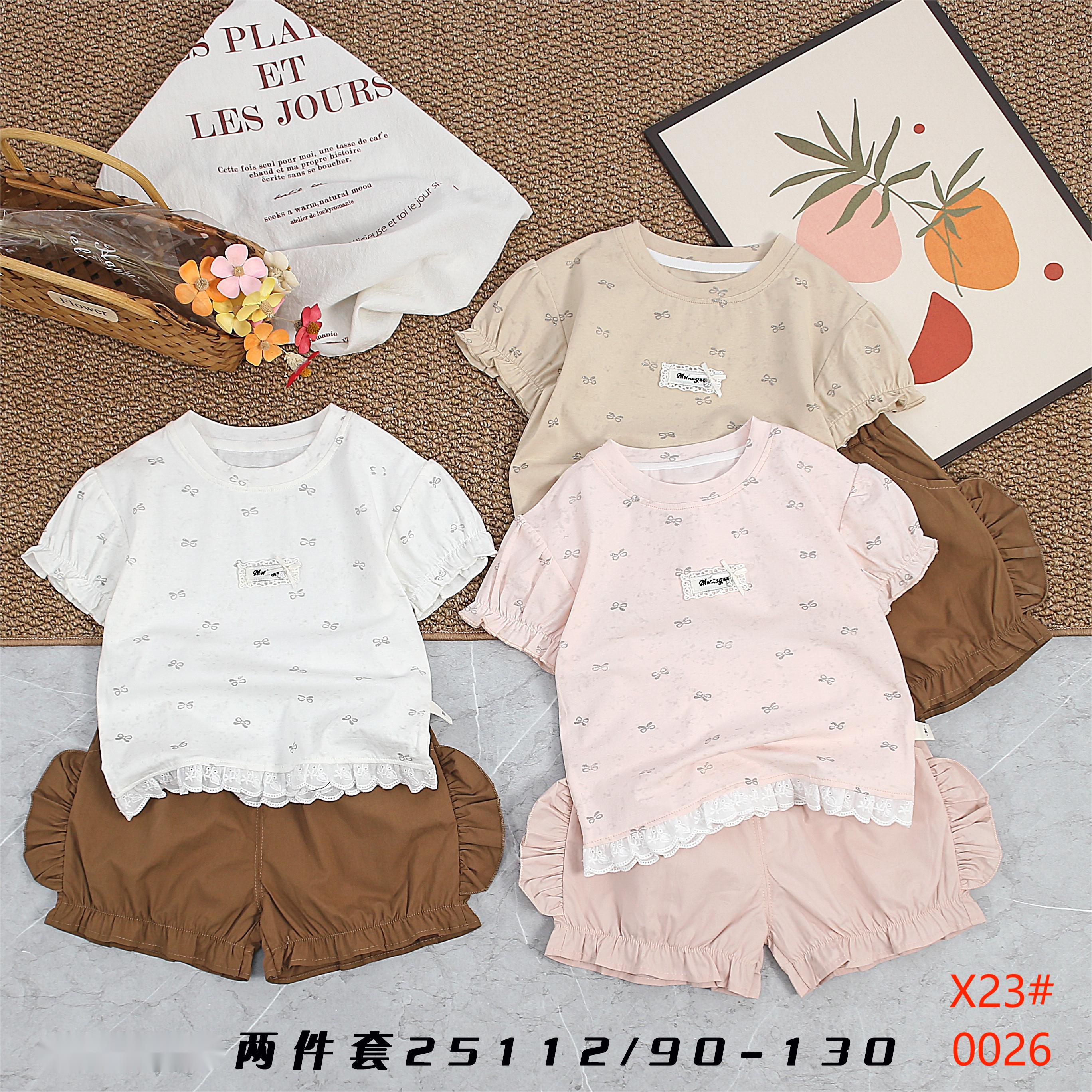 Two little girls in a lace top and shorts children's clothing set are sweet and cute