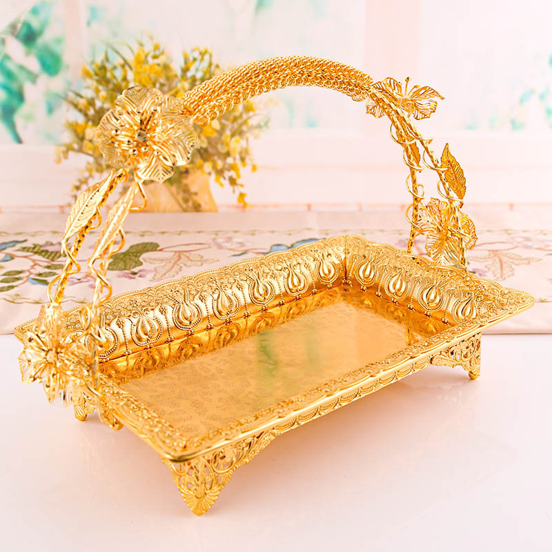 The main body of the golden decorative tray is a simple and modern home decoration item storage plate. It is a household decoration details Picture
