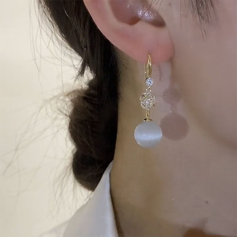 2026 Fashionable and elegant cat's eye stone Ball earrings, women's niche design sense, ear hooks, internet-famous, light luxury, high-end and fresh earrings details Picture