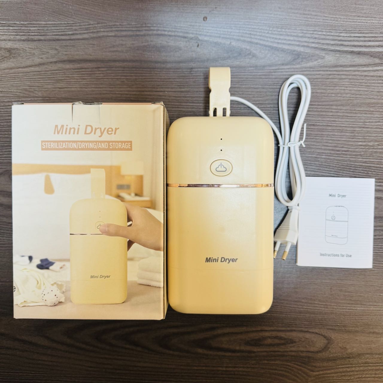 Mini Dryer is a portable and quick-drying household hair dryer with a soft sound design