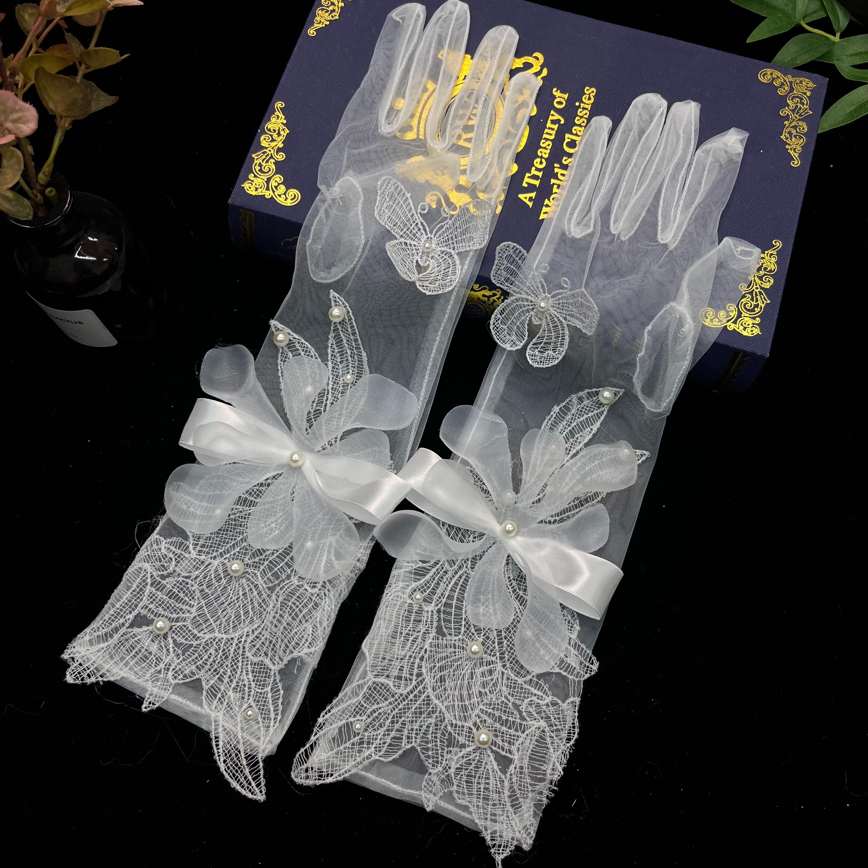 White lace gloves are elegant wedding dress accessories for ladies