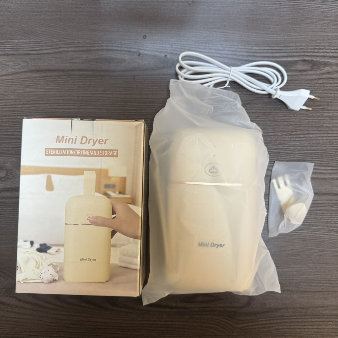 Mini Dryer is a portable and quick-drying household hair dryer with a soft sound design details Picture