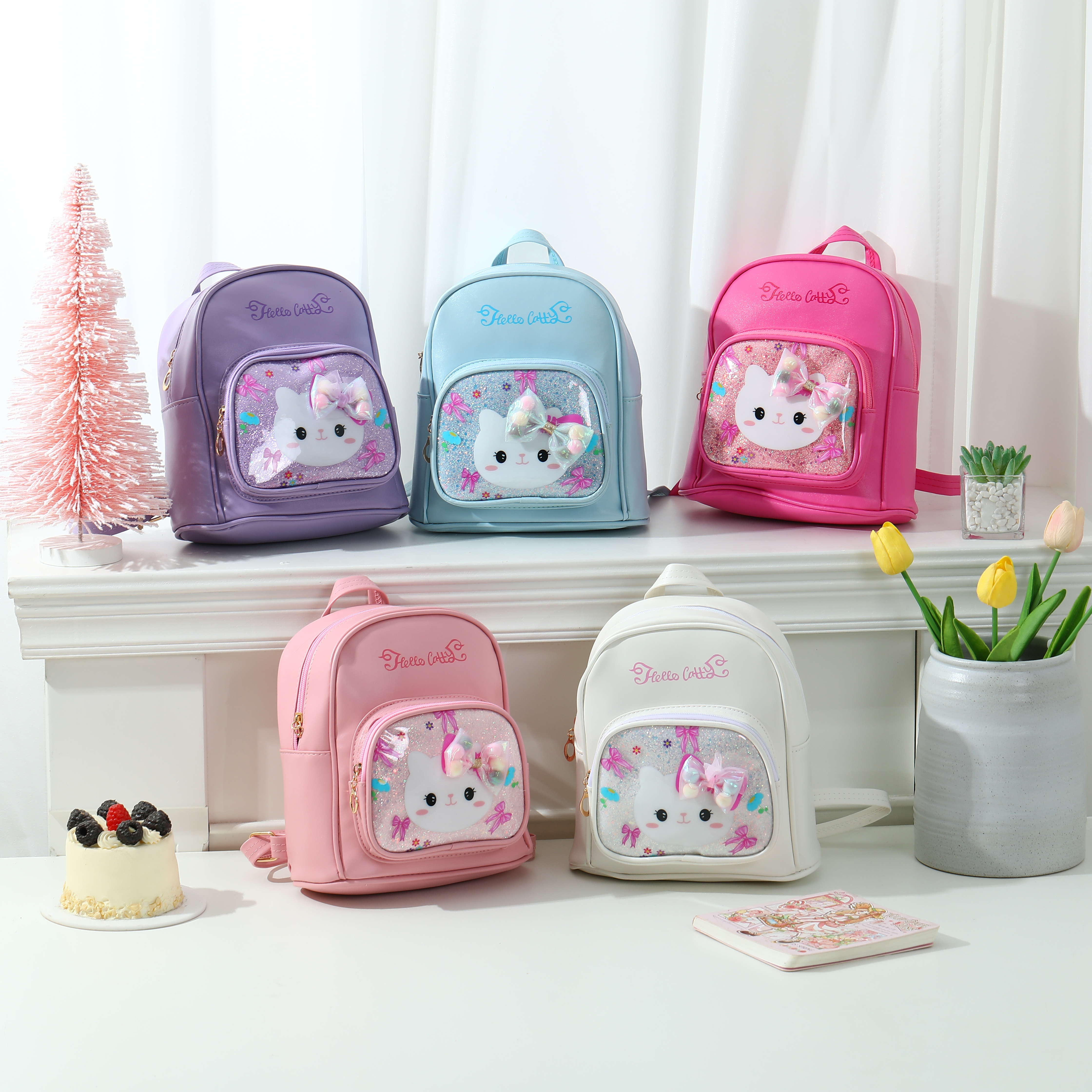 Cute cat in children's schoolbag