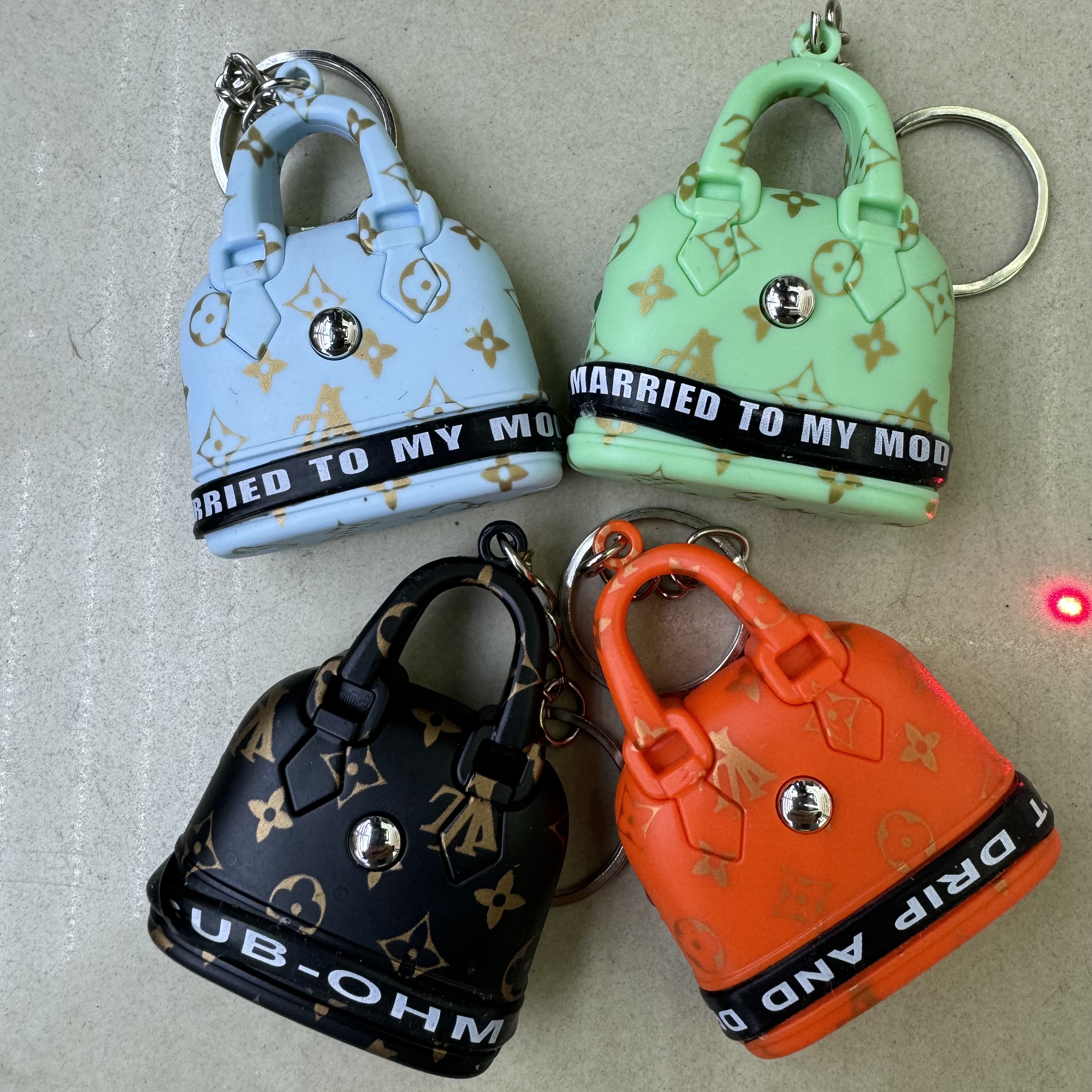 Mini handbag, multi-functional creative keychain, pendant, laser light, flashlight, convenient to carry, factory wholesale 130