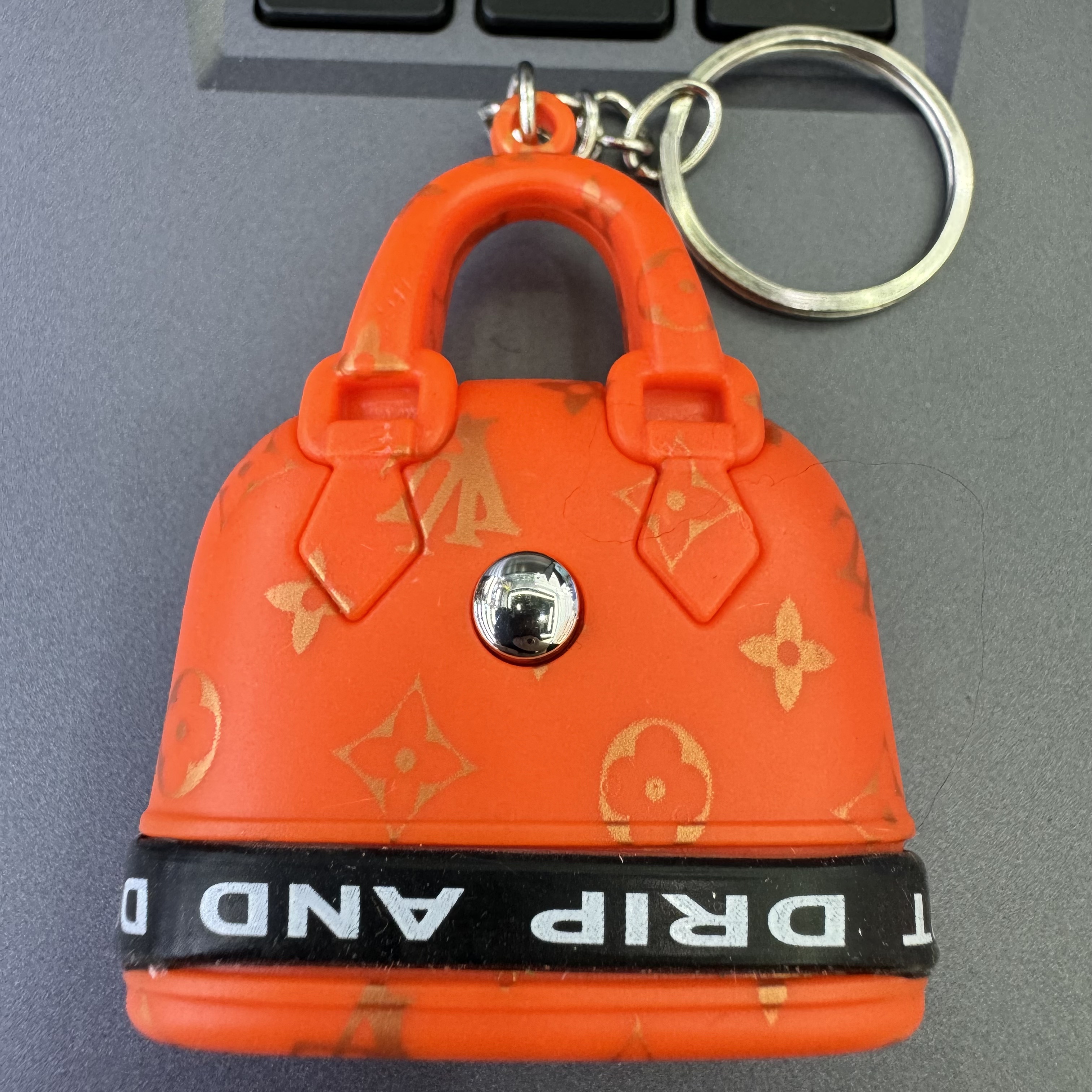 Mini handbag, multi-functional creative keychain, pendant, laser light, flashlight, convenient to carry, factory wholesale 130 Item Picture