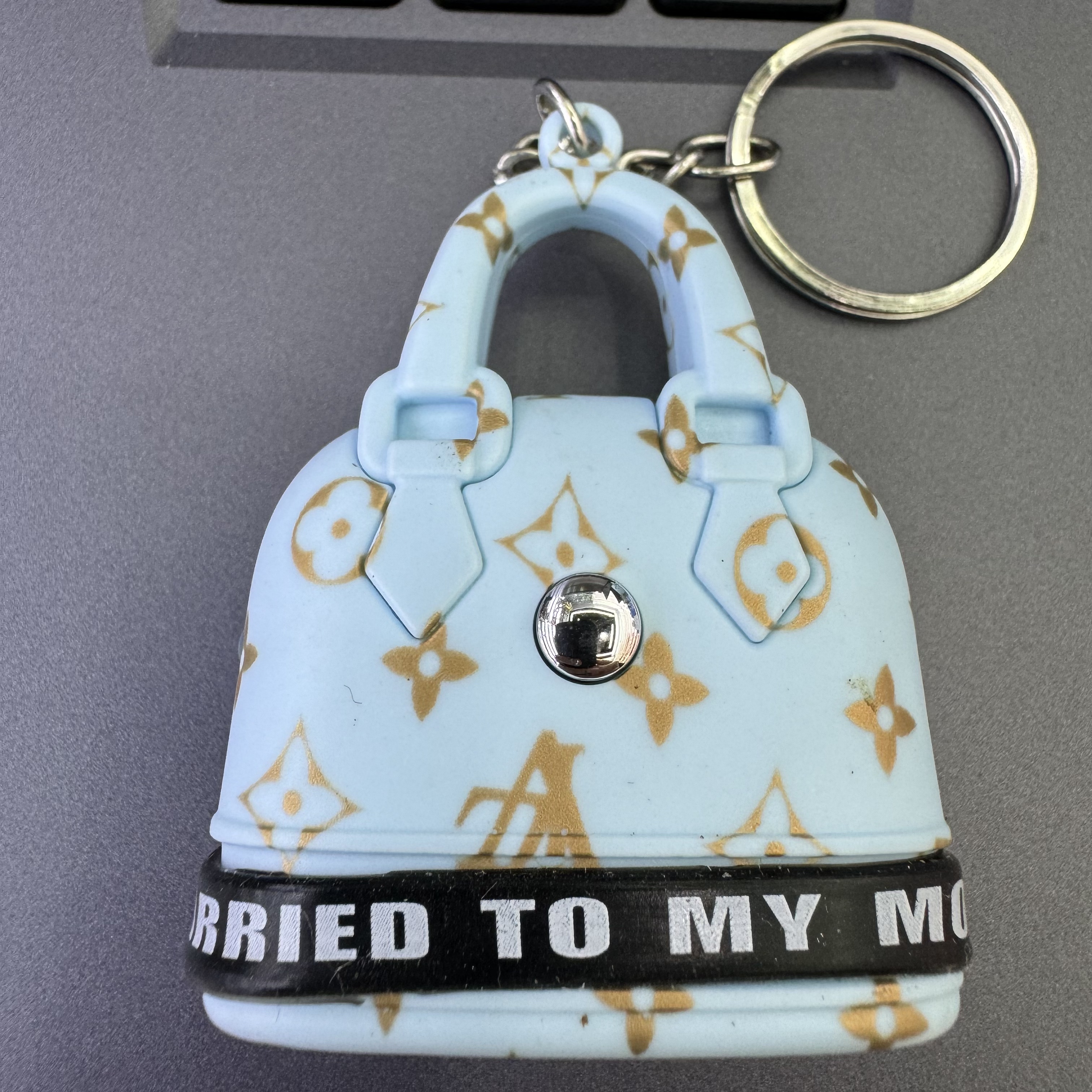 Mini handbag, multi-functional creative keychain, pendant, laser light, flashlight, convenient to carry, factory wholesale 130 Application Scenario