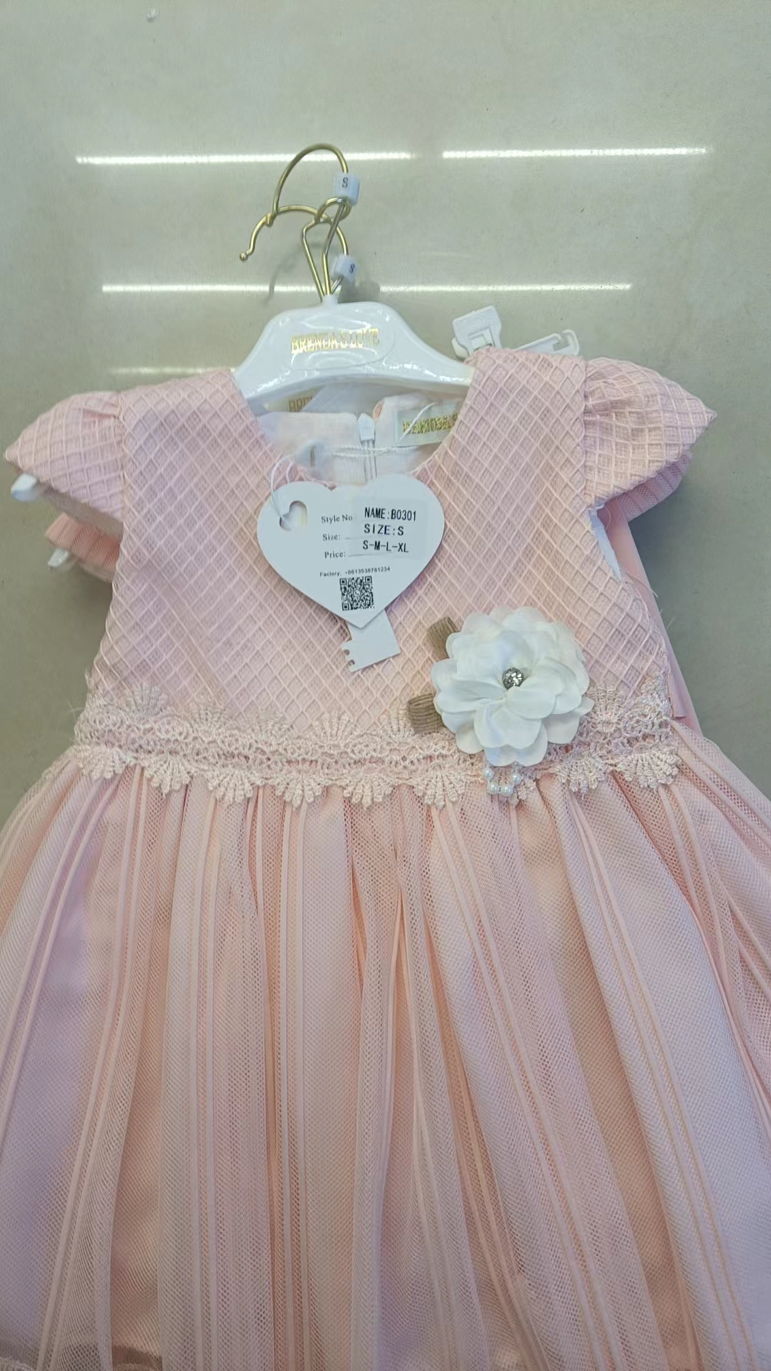 A pink, green and yellow multi-layered ruffled dress paired with white pants, a sweet and cool children's dress for young kids, and linen birthday supplies Application Scenario