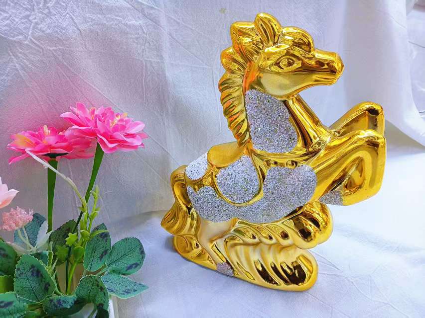 The living room wine cabinet is decorated with exquisite golden animal ornaments and a light luxury style golden horse ornaments detail image 2