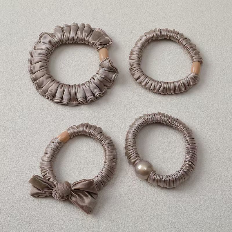 The new style of hair tie in 2026 features a simple pearl-like hair band, a large intestine band, and a high-elasticity thick leather band for women to tie their hair detail image 12