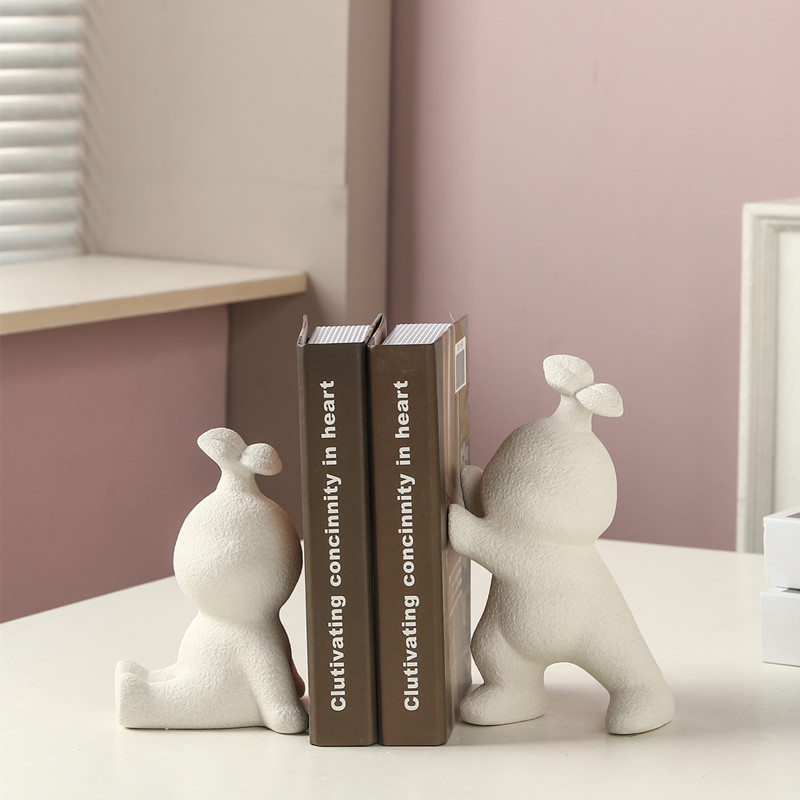 Minimalista viento lindo forma de conejo conejo de cerámica soporte de libro creativo portalibros gabinete decorativo sólo él pone artesanía