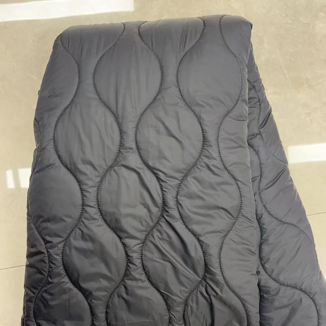 Quilted fabric is warm and dark grey