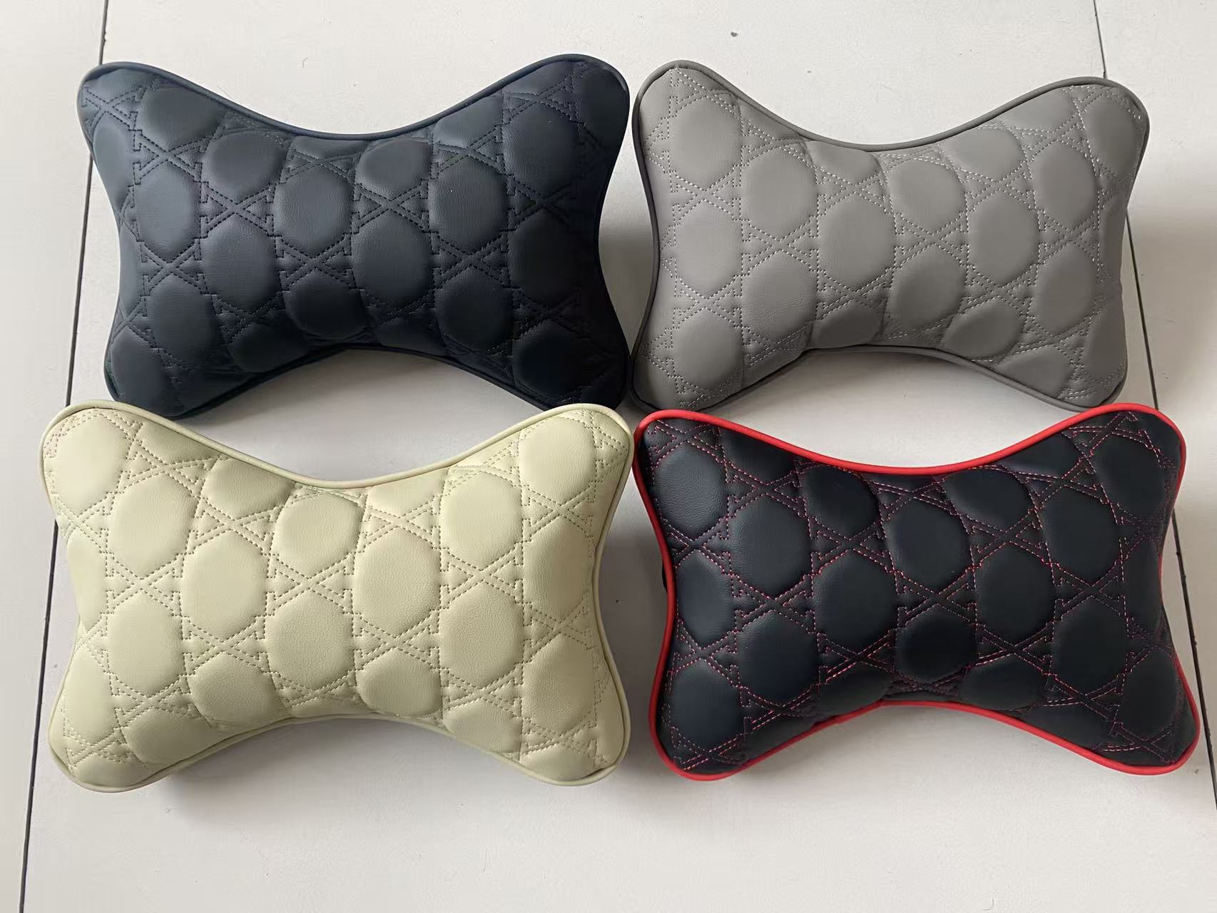 汽车枕头 骨头枕车载护颈枕皮革防水枕头绣花头枕