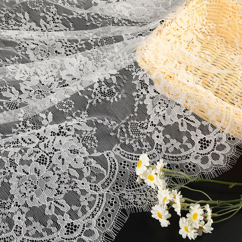 The shirt is made of white lace fabric with floral brocade and hollowed-out embroidery, featuring grey lace trim Specification image