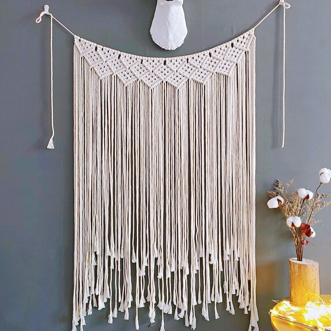 This Nordic Bohemian hand-woven tapestry features exquisite geometric patterns crafted from natural cotton threads. The flowing tassels are lively and elegant, making it suitable for bedroom headboards, living rooms, and soft furnishings in homestays Item Picture