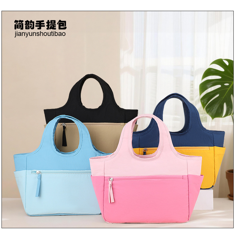 New color-blocked handbags, fashionable tote bags, large-capacity small bags for going out, storage bags, hand-carry bags, student travel