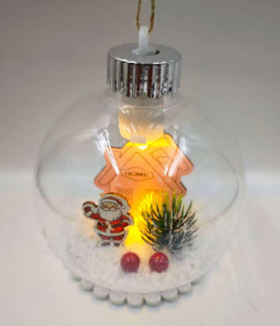 A 10CM plastic transparent snow scene Christmas ball with a light details Picture