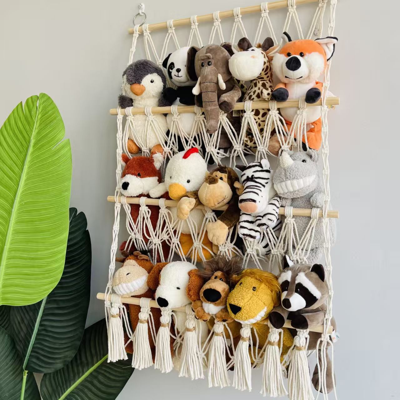 This Norse-style hand-woven multi-layer wall-mounted storage rack with tassel design integrates wall storage and decoration for children's rooms. It is made of cotton rope weaving, enhancing the warm and cozy atmosphere of the home. It is a perfect soft furnishing tool