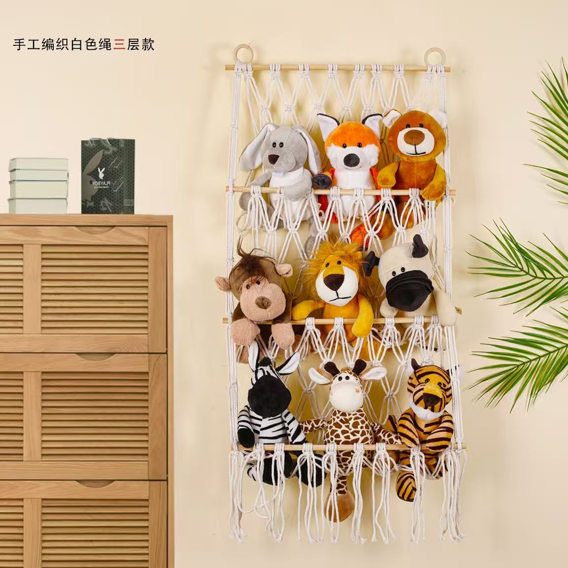 This Norse-style hand-woven multi-layer wall-mounted storage rack with tassel design integrates wall storage and decoration for children's rooms. It is made of cotton rope weaving, enhancing the warm and cozy atmosphere of the home. It is a perfect soft furnishing tool details Picture