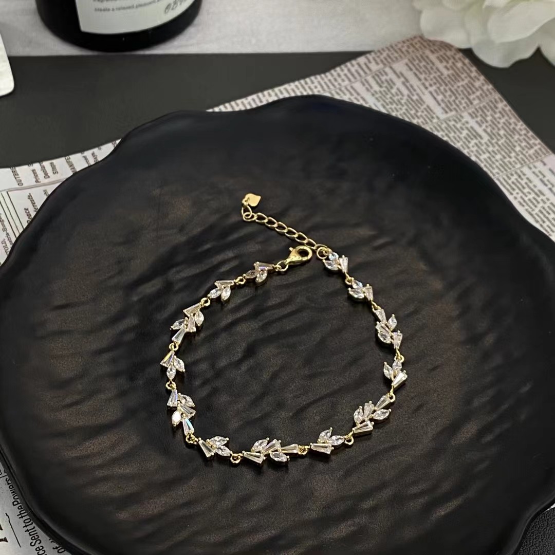 A fully diamond-encrusted leaf-shaped bracelet