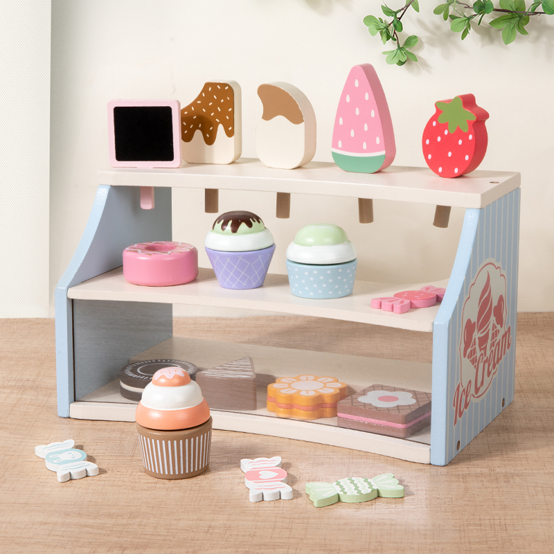 The ice cream vending counter is made of wood for playing house. It's a corner for children, parents and toddlers in the park. There are interactive role-playing toys. The wooden simulation ice cream store is selling house toys. The dollhouse is a miniature food play scene made of wood full figure