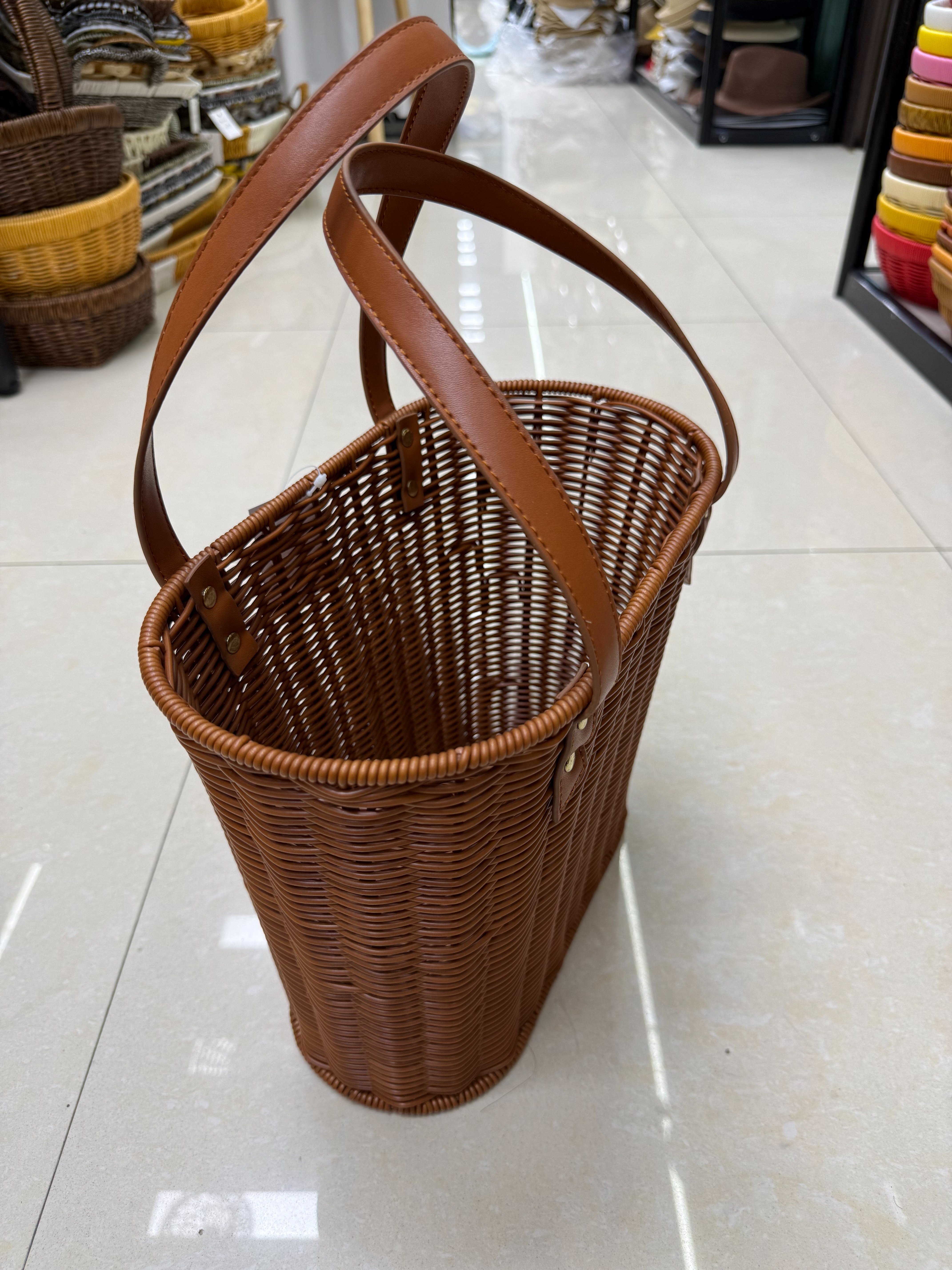 Brown woven basket handle basket, imitation rattan woven storage basket, storage woven storage basket, leather handle basket, grocery basket, shopping basket, supermarket gift packaging basket, retro woven basket Application Scenario