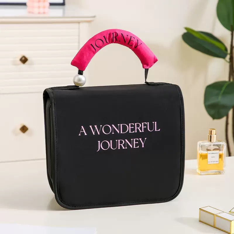 The new InS-style hand-held toiletry bag with pearl hooks from Adiva features a large capacity, waterproof and multi-functional storage