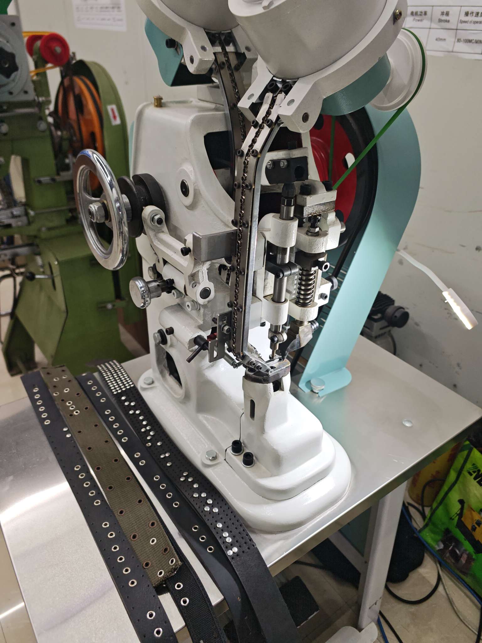 Automated corn-hole punching machine