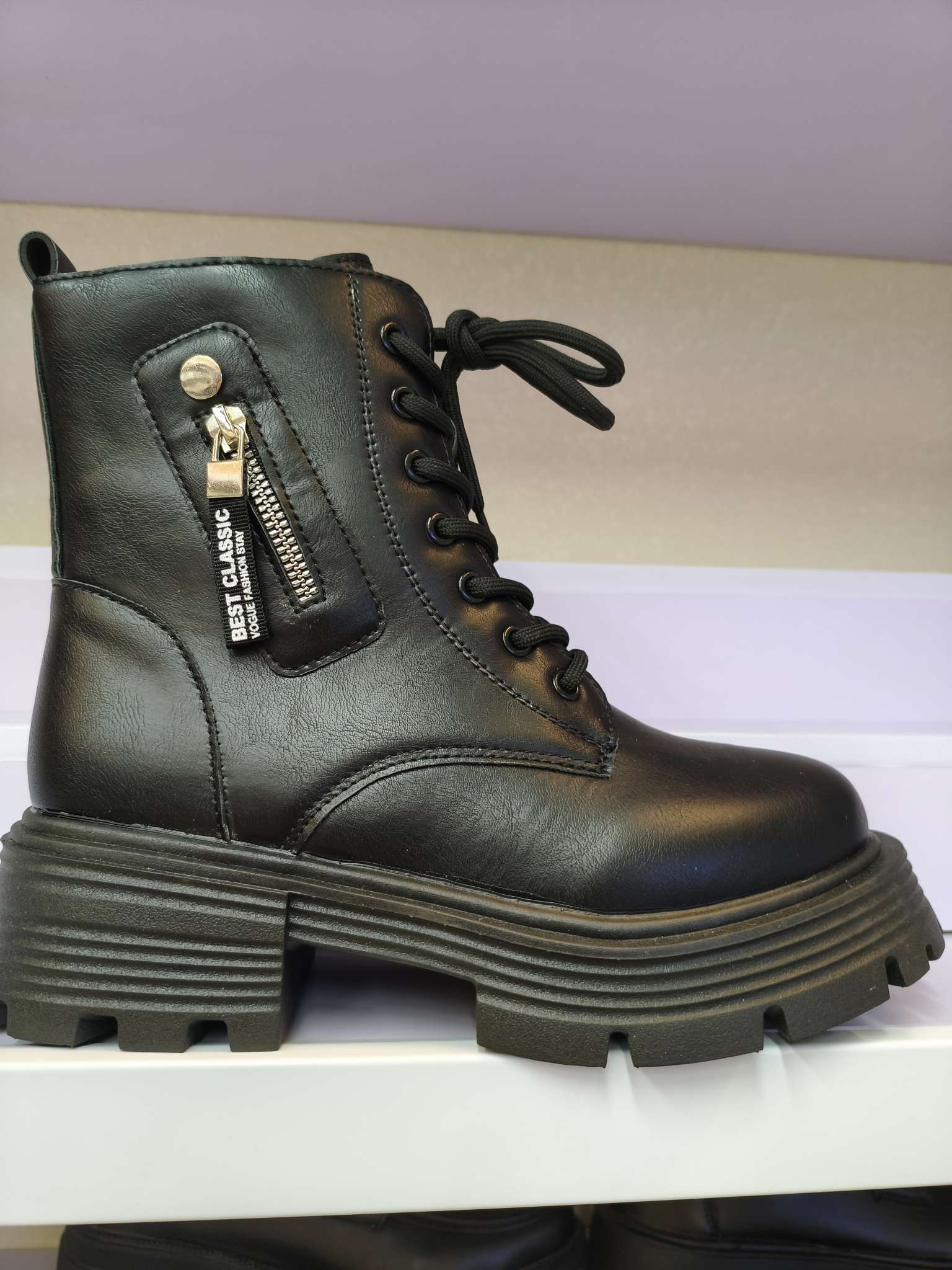 Thick-soled British-style Dr. Martens boots and black ankle boots