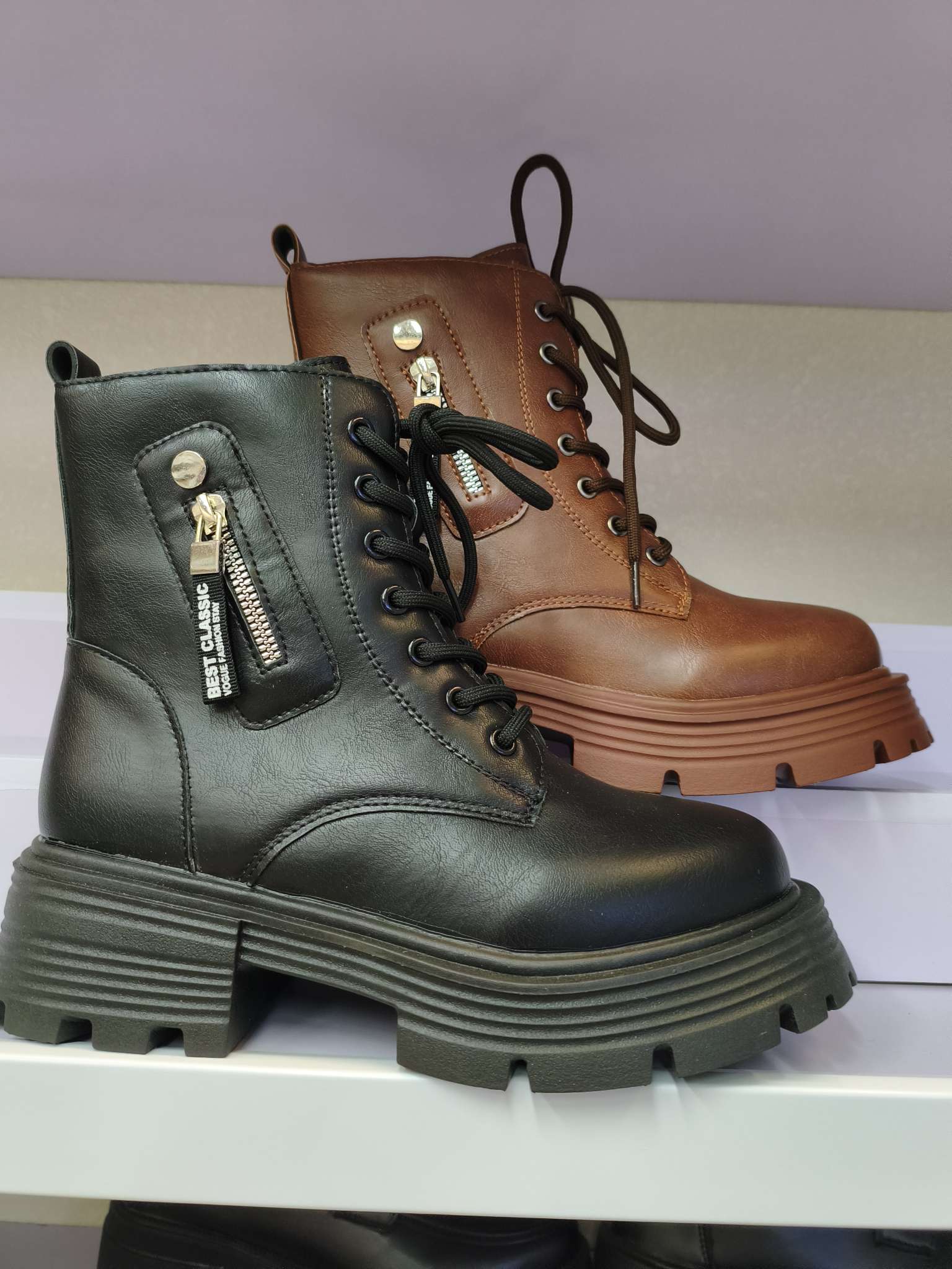 Thick-soled British-style Dr. Martens boots and black ankle boots detail image 3