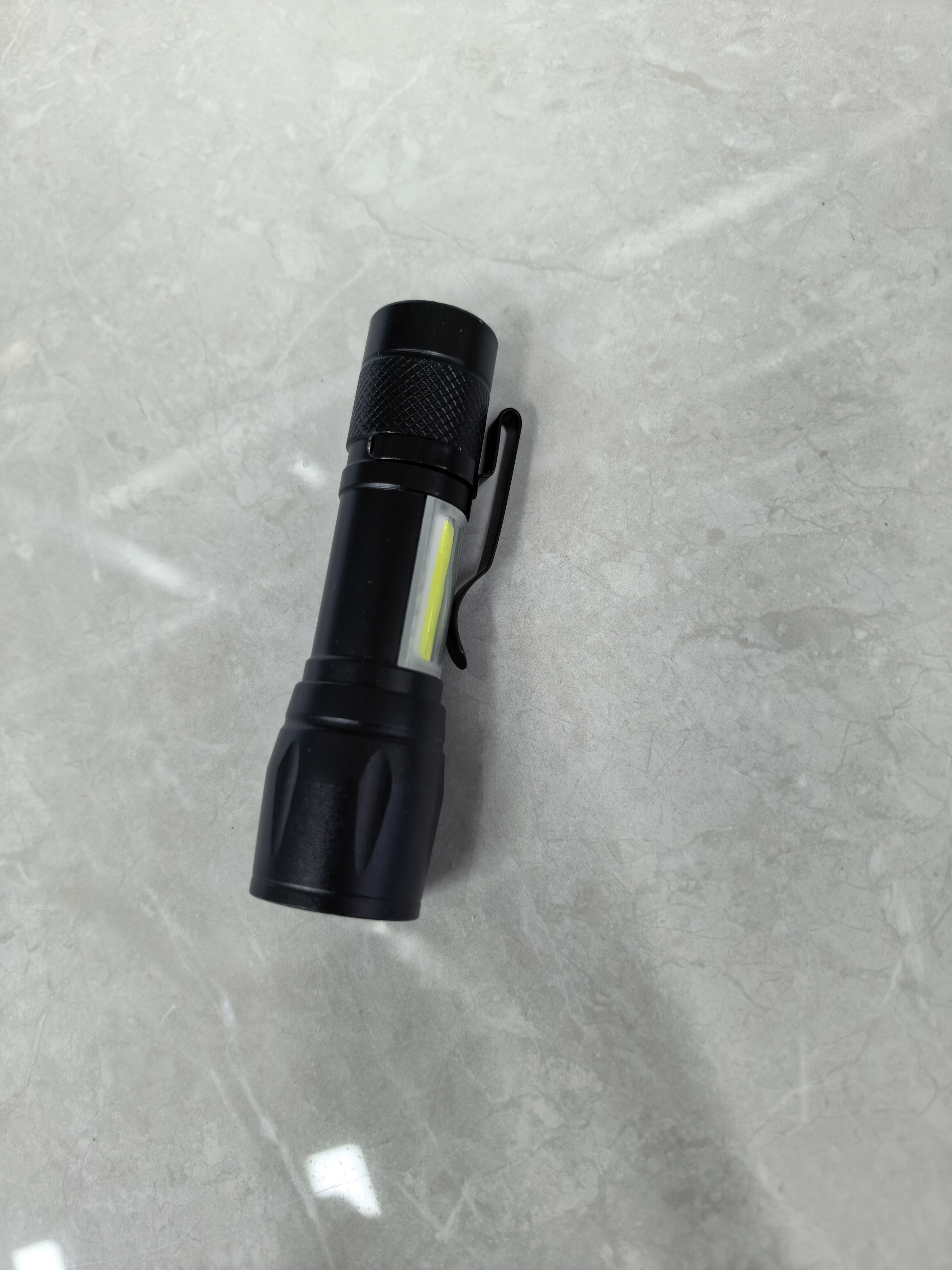 A small flashlight with built-in battery charging