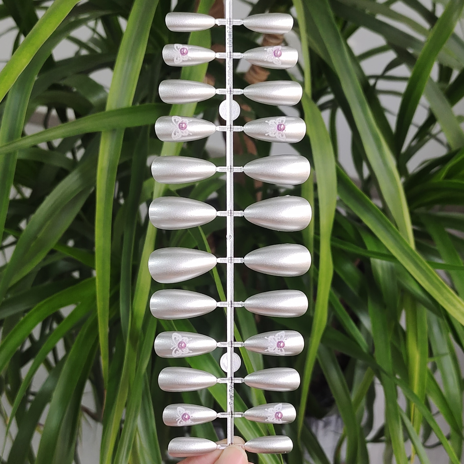 24 PCS PRESS ON NAIL TIPS ALMOND SHAPE ADHESIVE DESIGN WITH SLIVER BASE COLOR AND BUTTERFLY PATTERN full figure