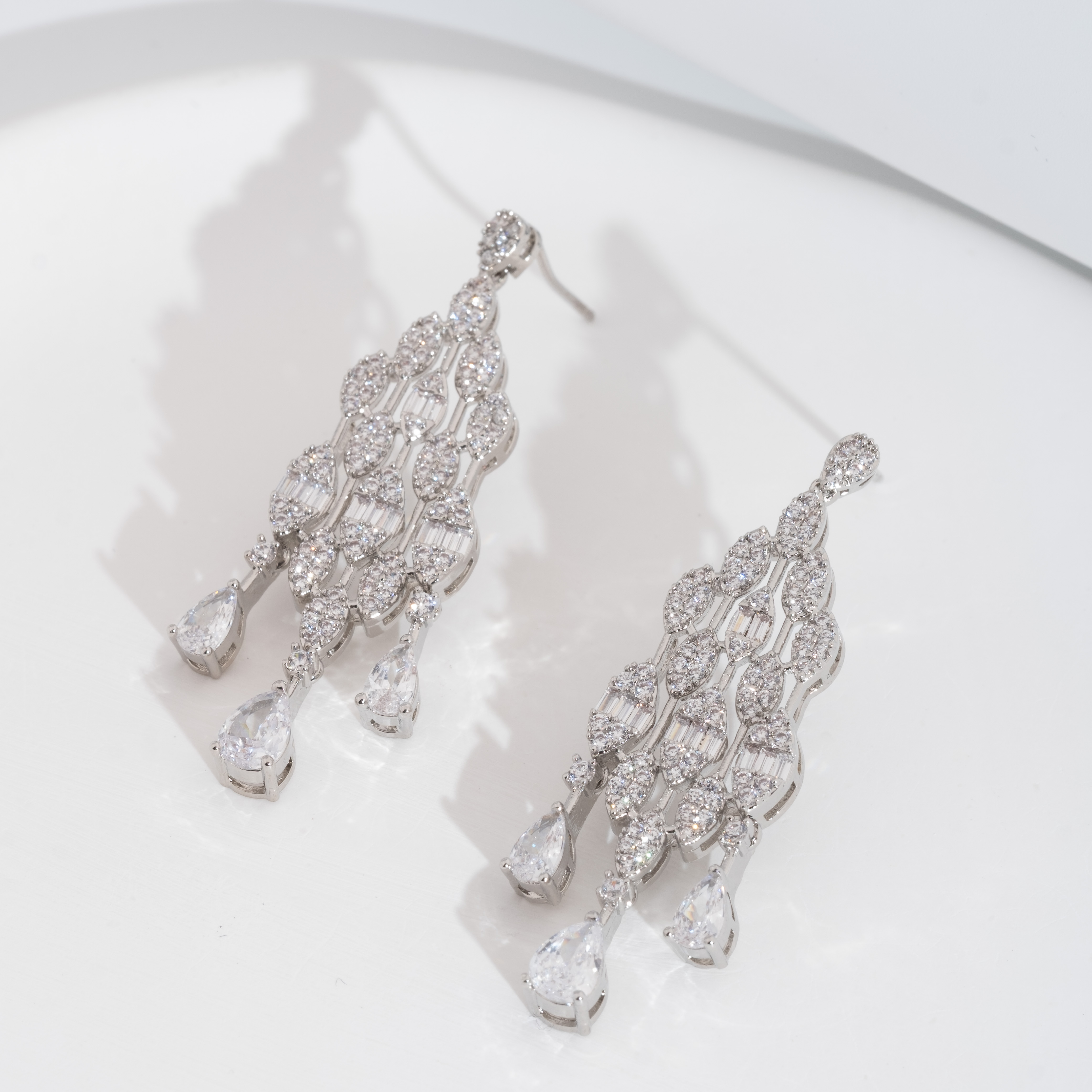 A set of elegant and sparkling cubic zirconia teardrop design earrings is suitable for ladies to wear at wedding banquets Specification image