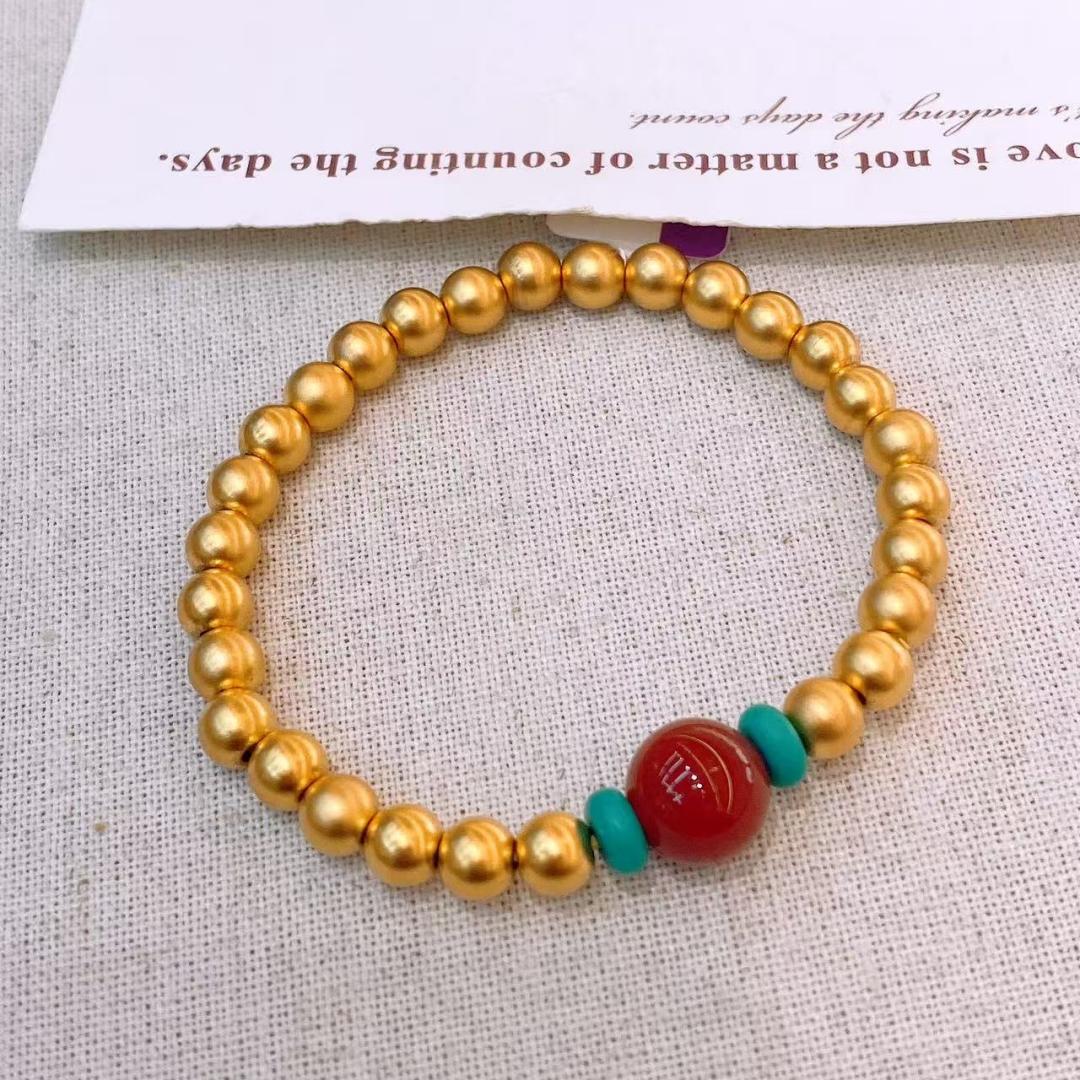 Copper gold-plated bracelet fashion item: Golden bead bracelet decorated with red and green gemstones, simple and fashionable Item Picture