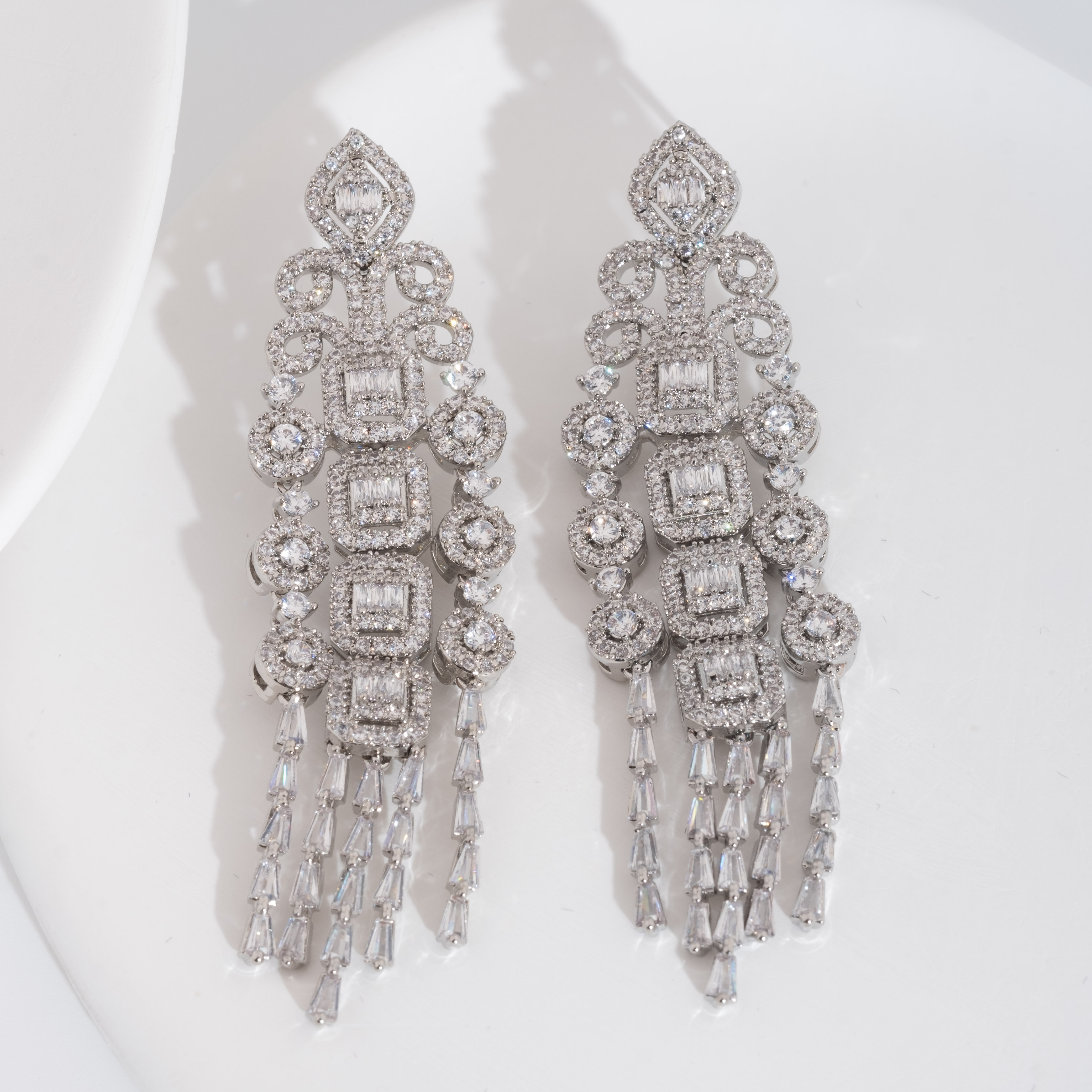 A set of luxurious and elegant earrings with a sparkling cubic zirconia pendant design is suitable for ladies to wear at weddings