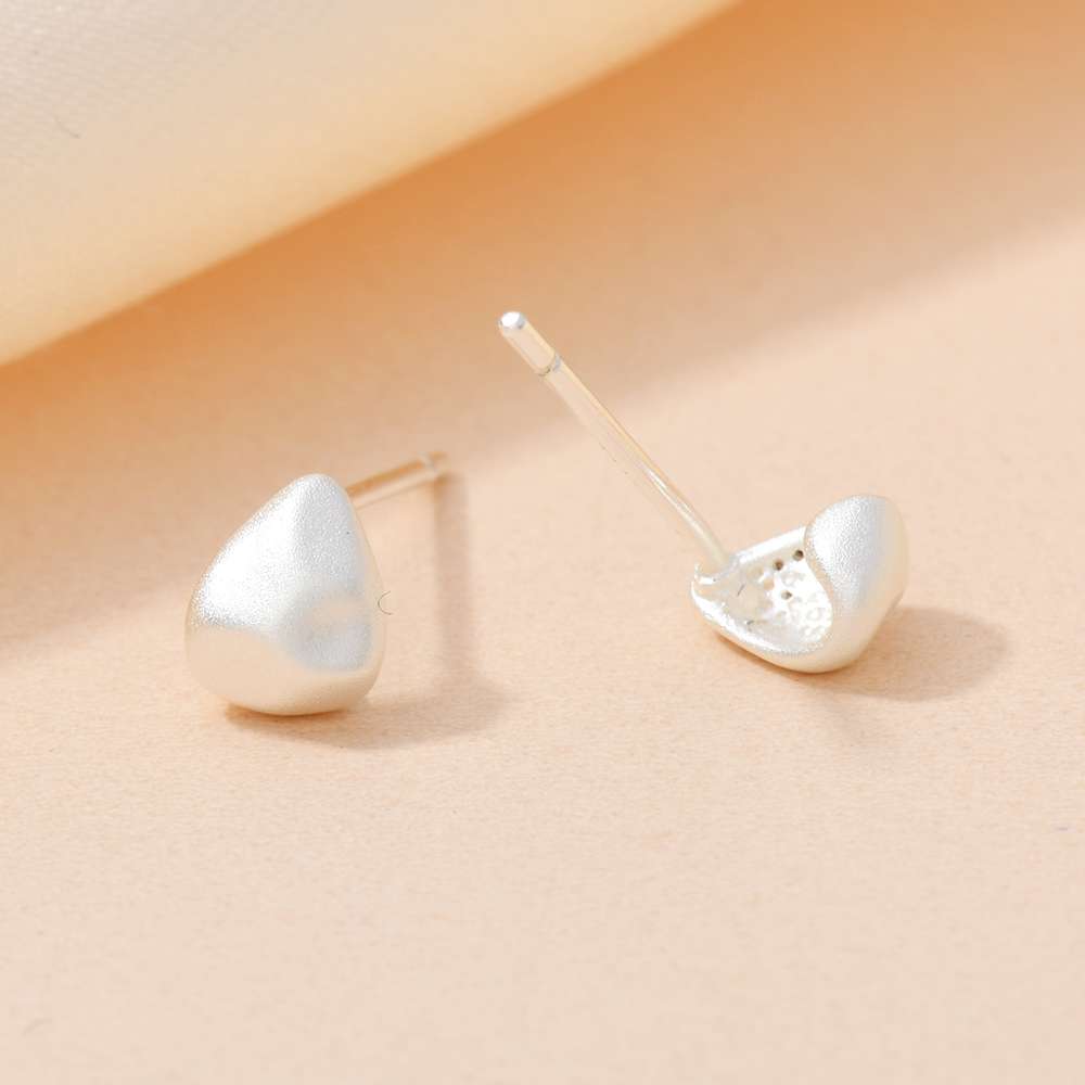 A pair of S925 sterling silver ear studs and needles for ear hole care accessories, fashionable and simple, with irregular water drop patterns detail image 3