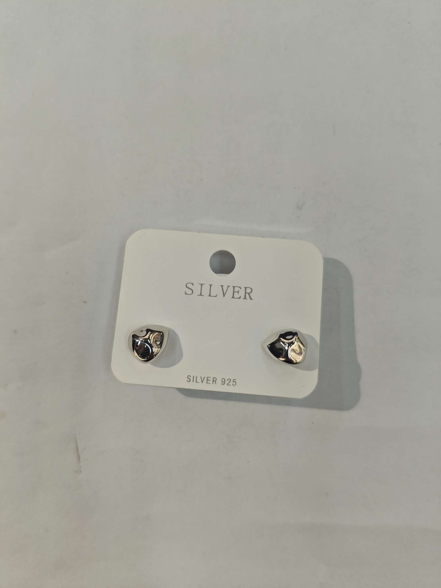 A pair of S925 sterling silver ear studs and needles for ear hole care accessories, fashionable and simple, with irregular water drop patterns detail image 4